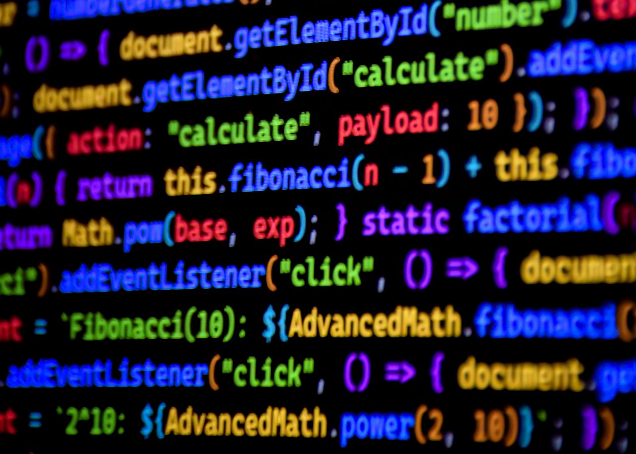 Home Bright and colorful JavaScript code displayed on a computer screen, showcasing programming.